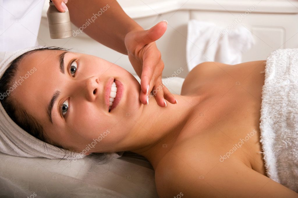 Young woman getting skin cleaning
