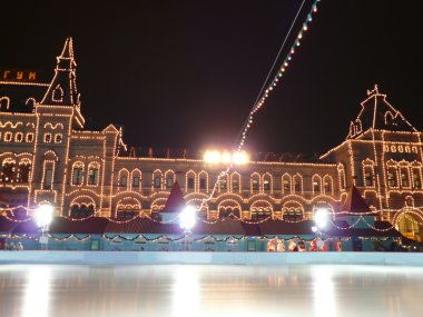 Skating-rink on red square at night clipart