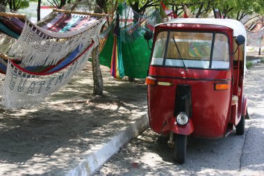 Motorcycle rickshaw and hammocks clipart