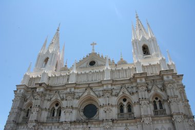 Bright white church in Central America clipart