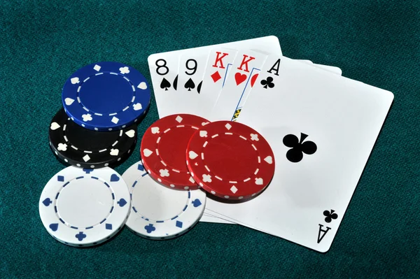 Poker hand with house chips. — Stock Photo, Image
