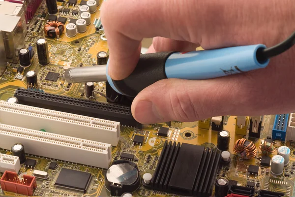 stock image Soldering a circuit board