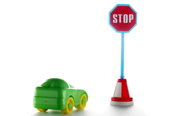 Car behind stop road sign — Stock Photo, Image