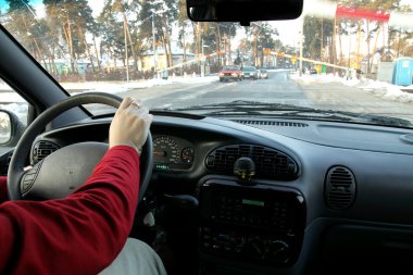 Waiting in the car on a rail crossing . clipart