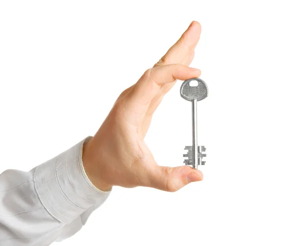 Mâna omului de afaceri, ţinând cheia — Fotografie, imagine de stoc