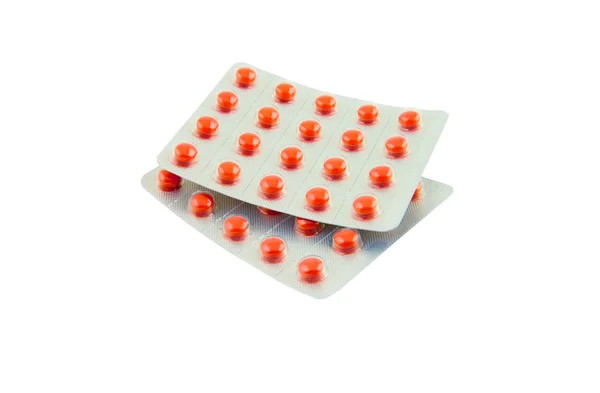 Píldoras rojas aisladas — Foto de Stock