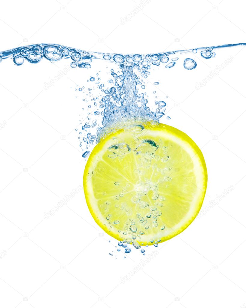 Lemon slice in water with bubbles