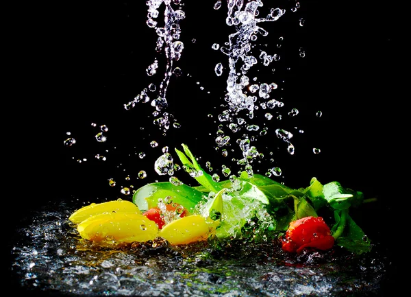Tulips in pouring water — Stock Photo, Image