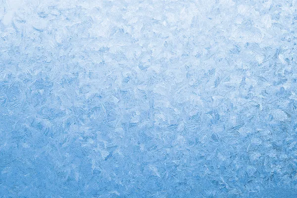 Licht blauw bevroren vensterglas Stockafbeelding