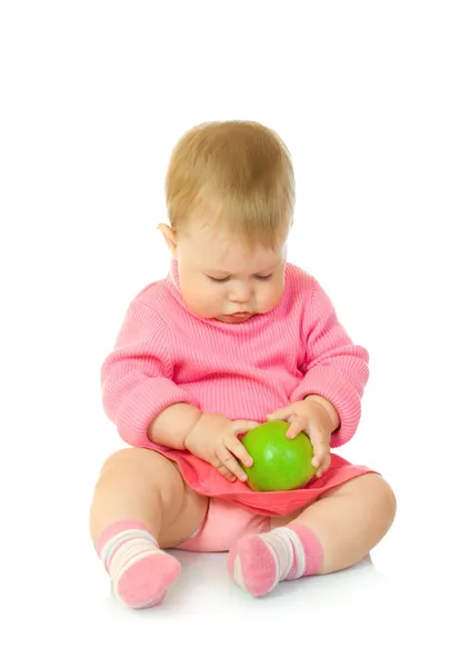 Small baby in red with green apple — Stock Photo, Image