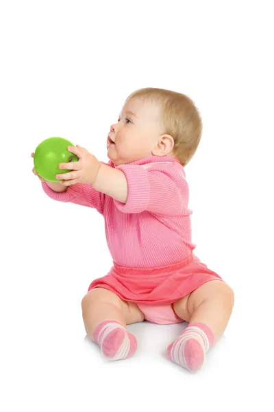 Pequeno bebê com maçã verde — Fotografia de Stock