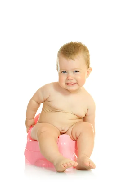 Pequeno bebê sorridente no pote da câmara rosa — Fotografia de Stock