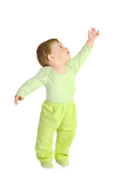Kleines lächelndes Baby in grün isoliert — Stockfoto