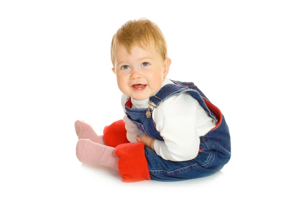 Small smiling baby in blue jeans isolate — Stock Photo, Image