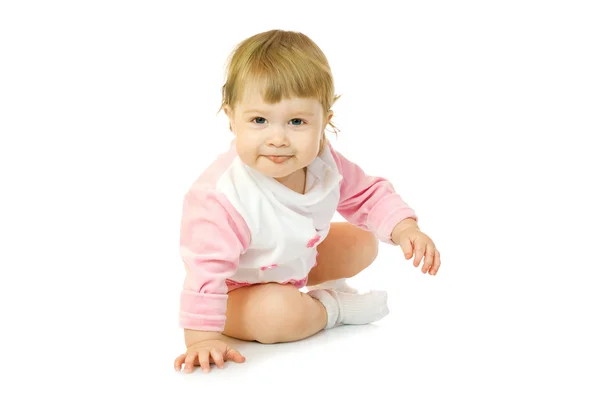 Sitzend kleines Mädchen im rosa Kleid — Stockfoto