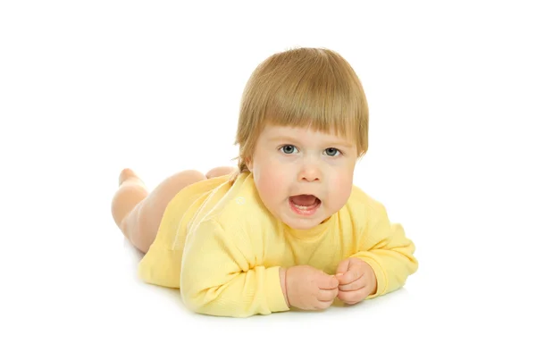 Laying small baby in yellow isolated — Stock Photo, Image