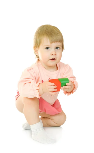 Małe dziecko z zabawkami na białym tle — Zdjęcie stockowe