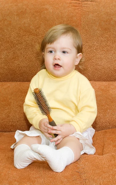 Small smiling baby with brush — Stock Photo, Image