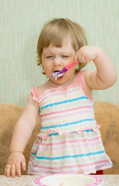 Little funny eating girl — Stock Photo, Image