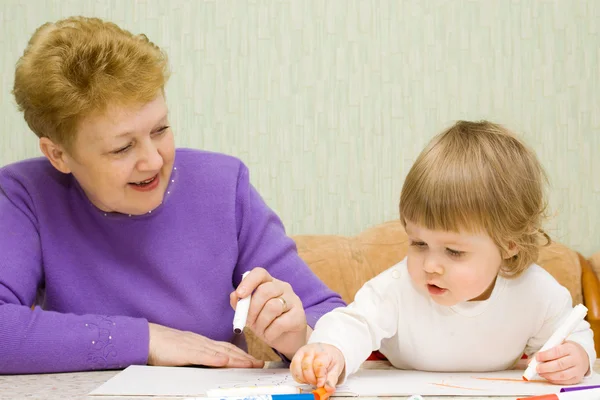 Small cute painting girl with grandma at — Stock Photo, Image