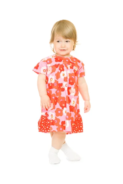 Pequeno bebê sorridente em vestido vermelho isolado — Fotografia de Stock