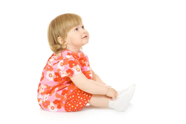Małe dziecko uśmiechający się w czerwoną sukienkę na białym tle — Zdjęcie stockowe