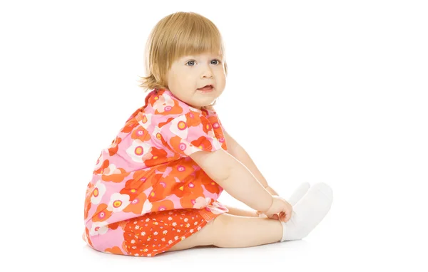 Kleine glimlachende baby in rode jurk geïsoleerd — Stockfoto