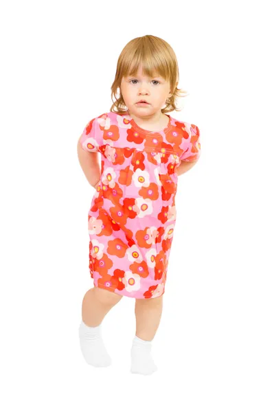 Klein meisje in een rode jurk geïsoleerd — Stockfoto