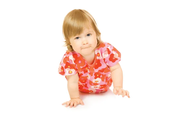 Liten leende bebis i röd klänning — Stockfoto