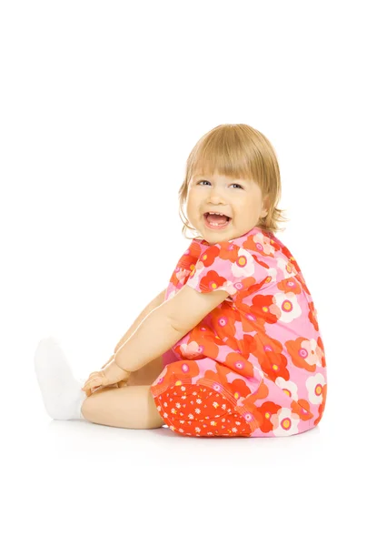 赤いドレスで小さな笑みを浮かべて赤ちゃん — ストック写真