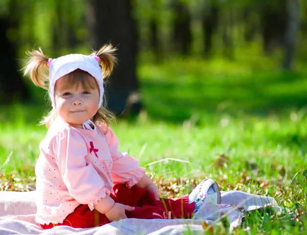 Small smiling little girl at summer fore — Stock Photo, Image