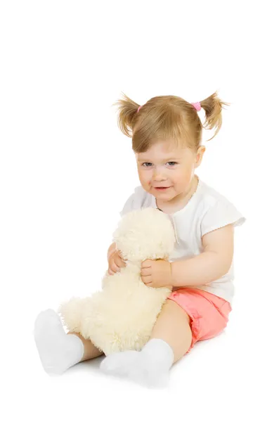 Mała dziewczynka z zabawkami Miś na białym tle — Zdjęcie stockowe