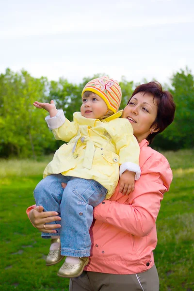 Mom and daughter resting in a wood — Stock Photo, Image