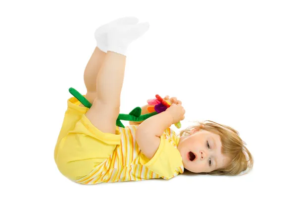 Klein meisje met speelgoed bloem — Stockfoto