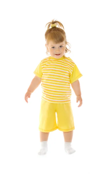 Küçük gülümseyen kız sarı pantolon ve s — Stok fotoğraf