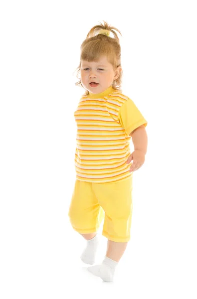Walking girl in yellow shirt and pants — Stock Photo, Image