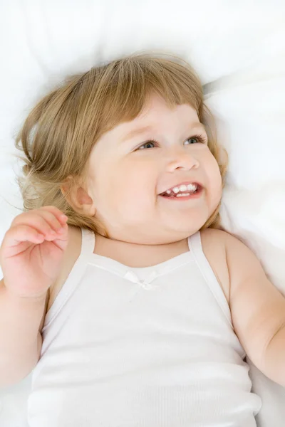 Little girl on a bed — Stock Photo, Image