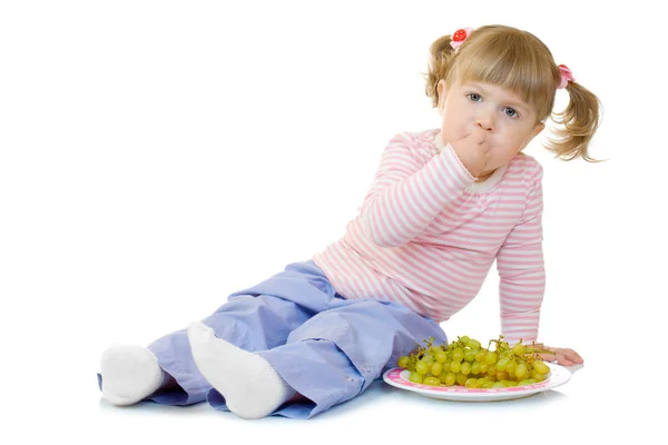 Little girl with grape — Stock Photo, Image