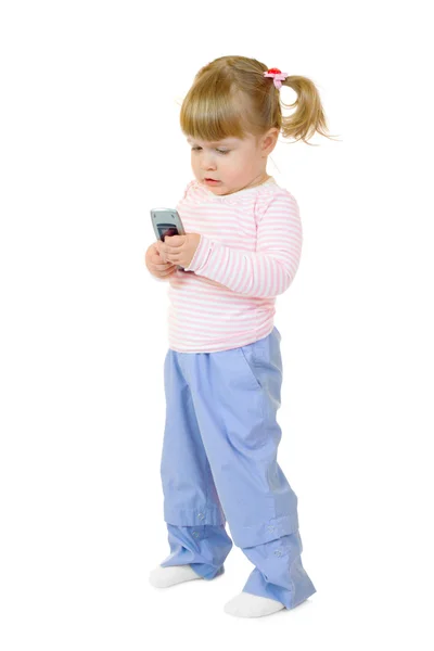 Liten flicka med mobiltelefon — Stockfoto