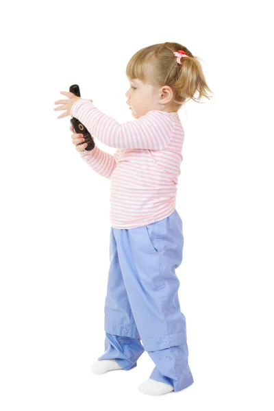 Klein meisje met mobiele telefoon — Stockfoto
