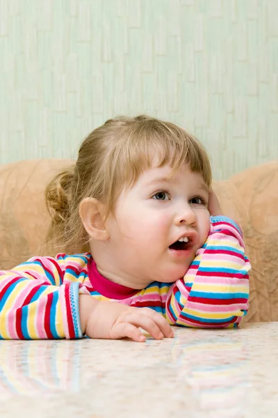 Ridiculous thinking little girl — Stock Photo, Image