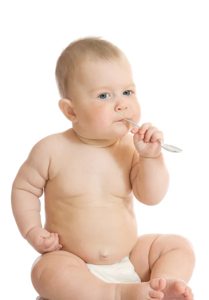 Pequeno bebê brincando com colher — Fotografia de Stock