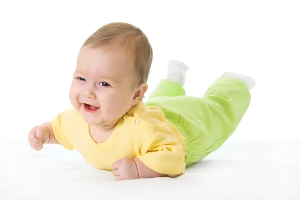 Bebê sorridente na cama — Fotografia de Stock