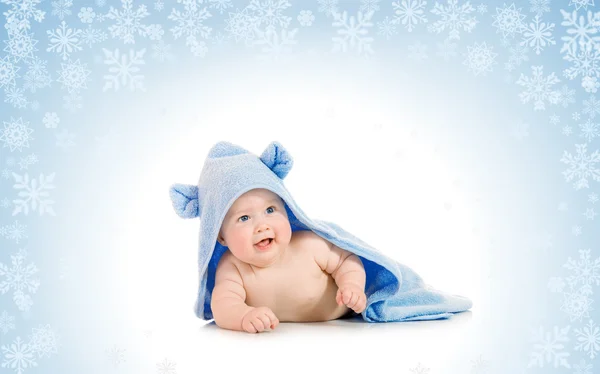 Small smiling baby with on snowy backgro — Stock Photo, Image