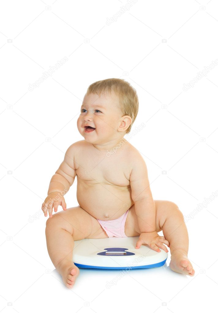 Small baby on home scales isolated