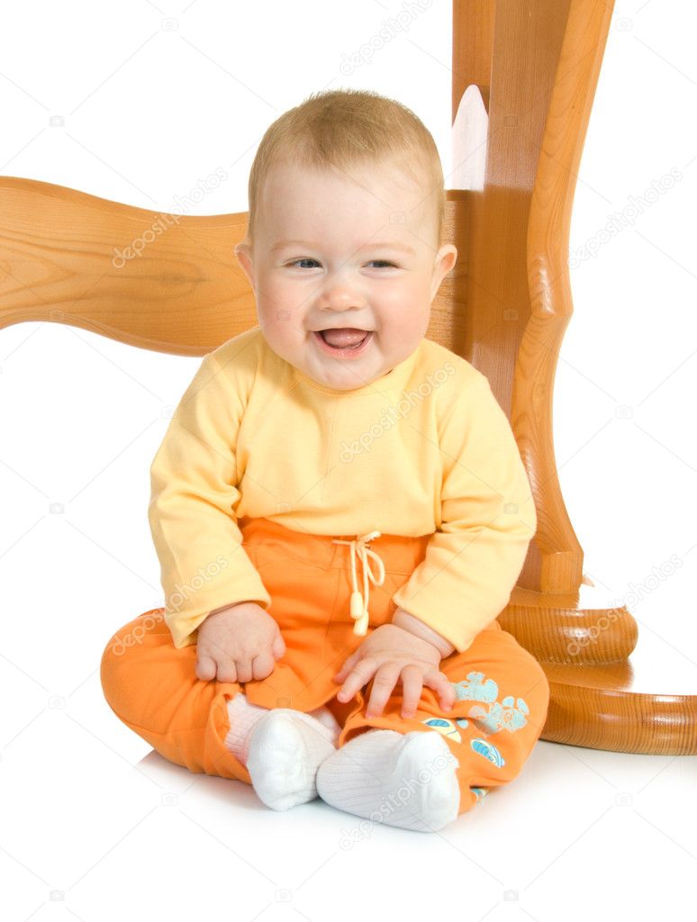 Small baby sitting with table