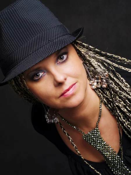 Party woman with braids in hat — Stock Fotó