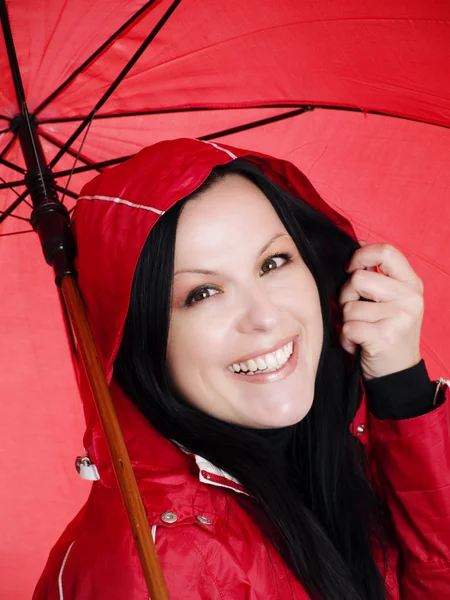 Smiling brunette woman in rainproof — Stock Photo, Image