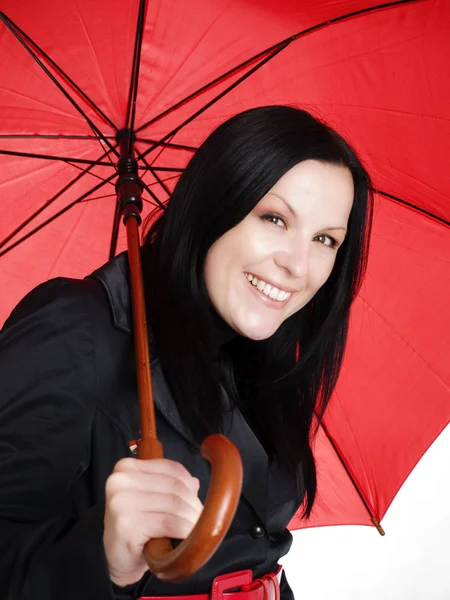 Smiling brunette woman with umbrella — Stock Photo, Image