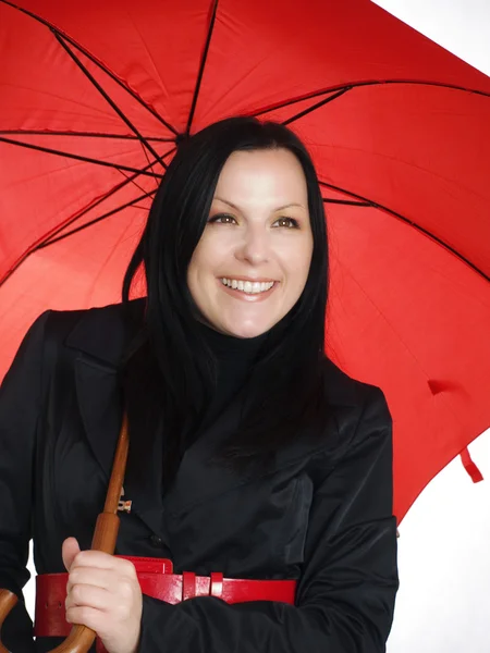 Smiling brunette woman in fall, rainproo — Stock Photo, Image
